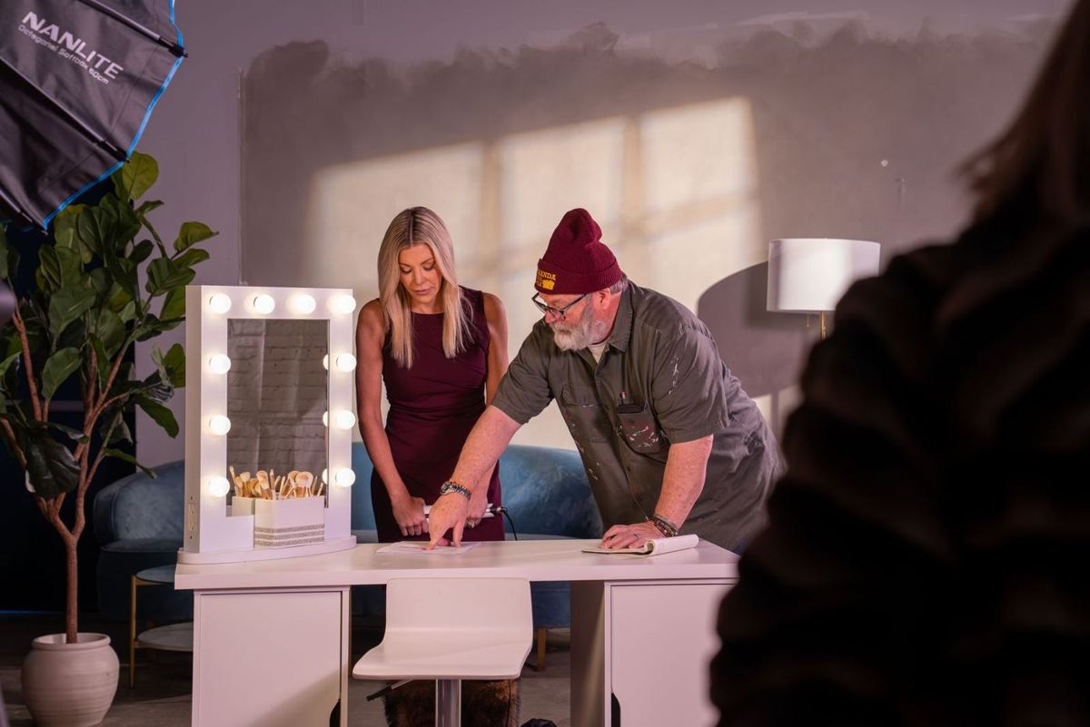 Crew reviewing the demo at the vanity